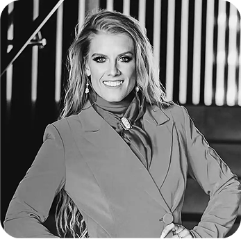 ADN team member headshot, black and white professional portrait of a woman in a blazer