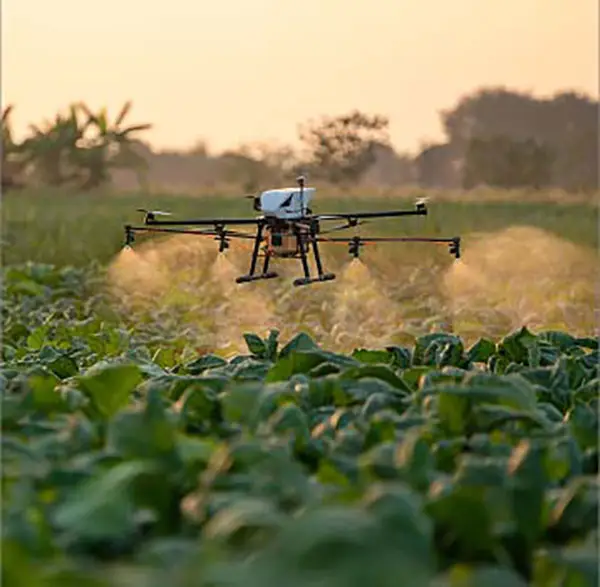 Agricultural drone spraying crops at sunset - ADN standardized fleet access for drone pilots